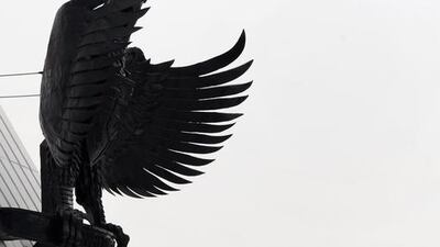 Australia's new prime minister Tony Abbott lays a wreath of flowers at Kalibata Heroes' Cemetery in Jakarta. Romeo Gacad / AFP