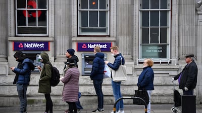 People queue for a supermarket, as the spread of the coronavirus disease (COVID-19) continues, in London, Britain, March 20, 2020. REUTERS/Dylan Martinez