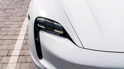 Raised front guards bookend a sloping bonnet.