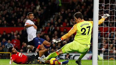 Manchester United's Marcus Rashford scores their third goal past Bournemouth's Asmir Begovic. Reuters