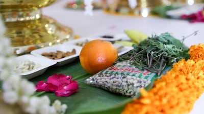 Priests recited Sanskrit verses and offerings included rice and flowers.