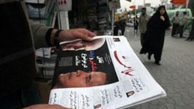 Meet the new boss: an Iranian man reads the daily newspaper Salamat on the morning of the 2008 American presidential election.