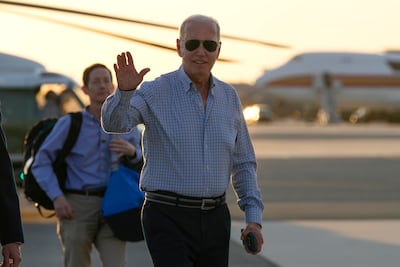 President Joe Biden waves as he walks to board Air Force One at Dover Air Force Base in Delaware. AP