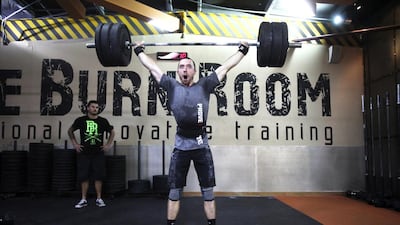 Members of the Burn Room, a CrossFit-only gym next to Mall of the Emirates, prepare to compete in a gruelling competition in South Korea. Justin Ahrens is pictured. Lee Hoagland / The National