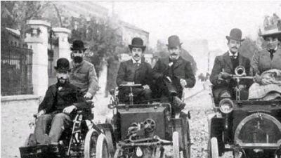 Marcel Renault, left, his brother Louis, centre, and Paul Huge ride on the early Renault models.