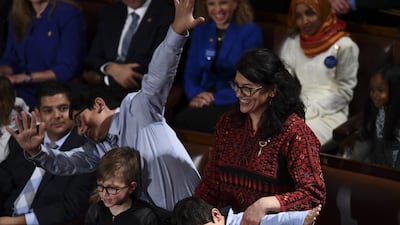 Member-elect Rashida Tlaib(D-MI) plays with her children during the 116th Congress and swearing-in ceremony on the floor of the US House of Representatives at the US Capitol. AFP