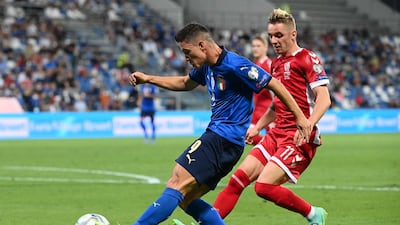 Italy forward Giacomo Raspadori is challenged by Lithuania's Arvydas Novikovas. AFP