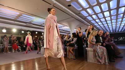 A model during the first floating fashion week experience of the Arab Fashion Week held at the Queen Elizabeth II Ship naval hotel at Port Rashid in Dubai. The room rate in the city during the first quarter averaged $293. EPA/ALI HAIDER
