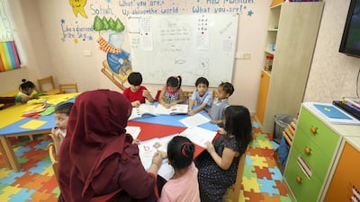 Prisoner's children take part in a lesson at the prison. Chris Whiteoak/The National