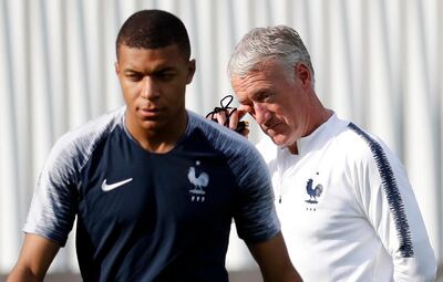 France manager Didier Deschamps, right, helped nurture the likes of Kylian Mbappe, left, to become a World Cup winner in 2018. EPA