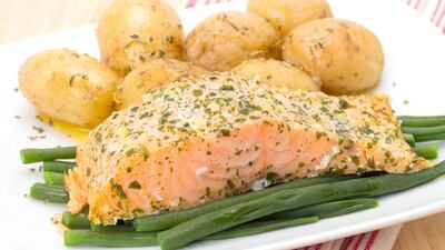 Potatoes in their skins and salmon are good sources of the mineral. Getty