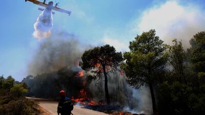 A firefighting plane helps tackle a wildfire in Keratea, southern Greece. EPA