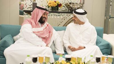 Sheikh Abdullah bin Zayed, Minister of Foreign Affairs and International Cooperation, right, speaks with Prince Mohammed bin Salman bin Abdulaziz Al Saud, Deputy Crown Prince, second Deputy Prime Minister, and Minister of Defence of Saudi Arabia,left, during a reception hosted by King Salman Bin Abdulaziz Al Saud, of Saudi Arabia and Custodian of the Two Holy Mosques (not shown), during an official visit to Saudi Arabia. Hamad Al Kaabi / Crown Prince Court - Abu Dhabi