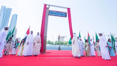 (L-R) Sheikh Khalid bin Mohamed, member of the Abu Dhabi Executive Council, Sheikh Hazza bin Zayed, Deputy Chairman of the Abu Dhabi Executive Council, and Turki Al Dakhil, Ambassador of Saudi Arabia to UAE unveil the new street name on Monday. Leslie Pableo for The National