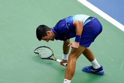 Novak Djokovic smashes his racket on the court after losing a point to Daniil Medvedev. AP Photo