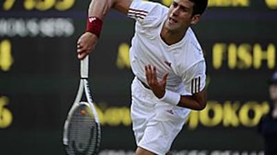 Novak Djokovic beat Mardy Fish in three sets to advance to the fourth round, and he is happy to avoid the pressure of being a tournament favourite.