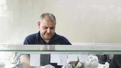 Hassan Qasmieh estimates he has served up millions of plates of falafel to hungry customers. Khushnum Bhandari for The National