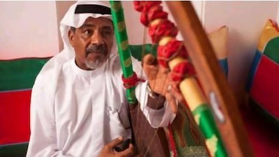 Taher Ismail, a retired army officer, plays his tambura at the Sharjah Directorate of Heritage majlis. Ismail has been playing since he was 10 and wishes more young people would learn the old instruments.