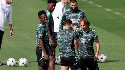 Real Madrid's Luka Modric jokes with Dani Carvajal. AFP