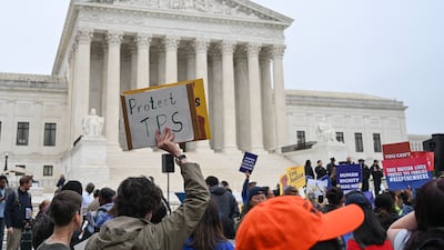 Members of the National TPS Alliance protest outside the US Supreme Court in Washington. AFP