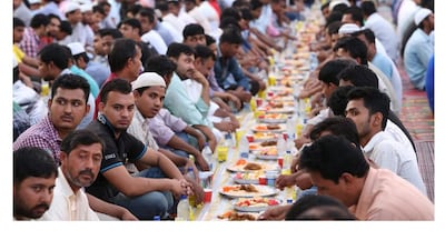 Residents of Muscat’s Al Seeb neighbourhood pay restaurants to provide homeless workers with free meals. Saleh Al Shaibany for The National