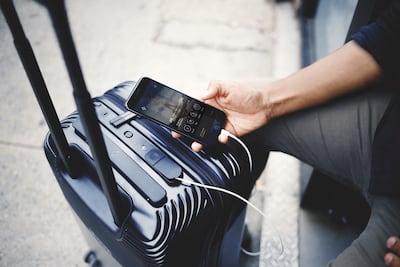 You can leave your phone charger at home when you travel with a smart suitcase. Photo: Nicolas Castillo / Bluesmart