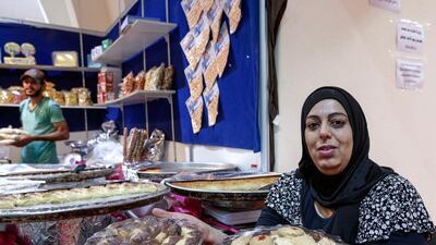 Samar Mohammad displays her sweets and assorted cookies at the Eid fair in Fujairah. Victor Besa for The National