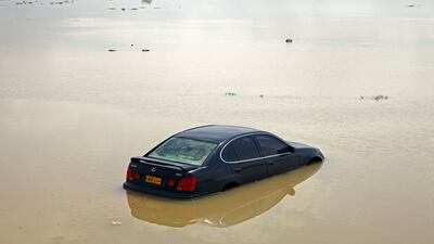 A car is stranded in flooded street in the Omani capital, Muscat. Photo: AFP