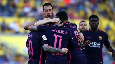 Barcelona forward Neymar celebrates with teammates after scoring the first goal against Las Palmas. Charlie Crowhurst / Getty Images