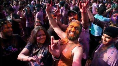 Covered in paint and water, people celebrate Holi yesterday at Dubai's Wonderland theme park. The Hindu religious festival has over the years evolved into a secular party, compete with dancing and eating.