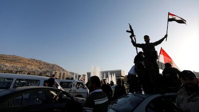 Syrian people protest against US-led air strikes in a street in Damascus. Omar Sanadiki / Reuters