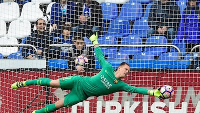 Barcelona’s German goalkeeper Marc-Andre ter Stegen dives to stop the ball. Miguel Riopa / AFP