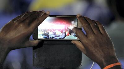 One of the worker records the DU & Western Union Camp Ka Champ competition.