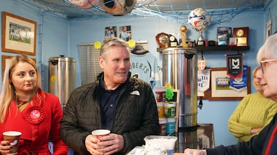 Labour leader Keir Starmer (centre )and Labour MP Gen Kitchen (left) in Dale's Bar in Rushden, Northamptonshire, UK, on February 13. PA Photo.
