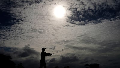Bryson DeChambeau watches his tee shot on the first hole. AP