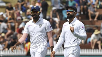 Jasprit Bumrah, left, Virat Kohli and the India squad were due to play four Test matches and three one-day internationals Down Under. AP