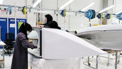 Workers working on the parts for Airbus and Boeing in the Assembly section at the Strata Manufacturing facility in Al Ain. Pawan Singh/The National