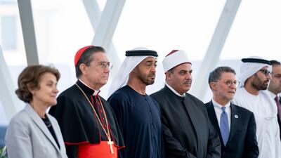 Sheikh Mohamed bin Zayed stands for a photograph with members of the Higher Committee of Human Fraternity.