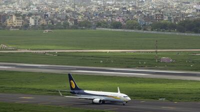 An aircraft operated by Jet Airways India Ltd. is seen from a control tower as it taxis along the tarmac at Indira Gandhi International Airport (IGI) in Delhi, India, on Monday, July 18, 2016. The world's fastest-growing major aviation market is grappling with a paucity of traffic controllers to meet growing demand, as many of them shun employment with the state-run Airports Authority of India, where starting monthly salaries can be as low as $250, and choose monetarily rewarding jobs with private airlines. Photographer: Prashanth Vishwanathan/Bloomberg