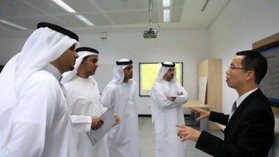 Dr. Kin Fai Poon, Chief Researcher at Ebtic interacting with researcher of Etisalat and Khalifa University staff, during an site tour of Etisalat-BT Innovation centre and R and D facilitybetween two operators to increase telecoms development in the region on Sunday at Khalifa University in Abu Dhabi. Ravindranath K / The National
