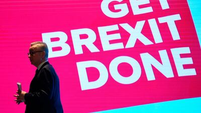 Britain's Chancellor of the Duchy of Lancaster Michael Gove leaves the stage after an address on delivering Brexit on the first day of the annual Conservative Party conference in Manchester on September 29, 2019. AFP