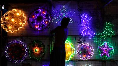 A Filipino vendor sells lanterns at a street in Las Pinas City, Philippines. EPA