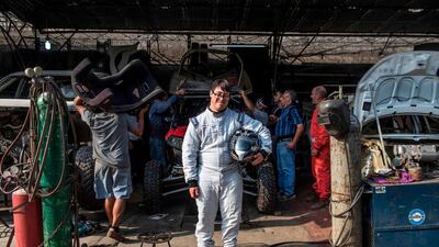Lucas Barron, 25, poses for a picture at a mechanics workshop in Lima. AFP