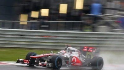 Jenson Button hopes there won't be as much standing water as there was today. Valdrin Xhemaj / EPA
