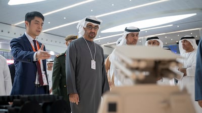 Sheikh Mohamed visits a booth at Idex