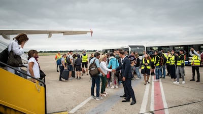 People disembark from a Slovak government flight arriving from Amman, Jordan, in Bratislava, Slovakia. EPA
