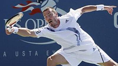 Marat Safin stretches for a return during his match against Jurgen Melzer in the first round of the US Open.