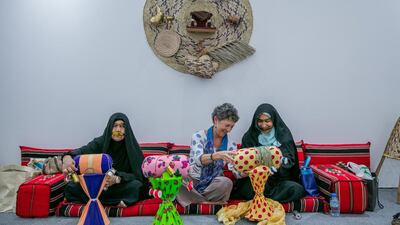 A visitor learns the art of traditional weaving during Ramadan Evenings, an event at Manarat Al Saadiyat. Courtesy Abu Dhabi Tourism & Culture Authority