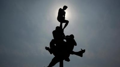 Indian army soldiers display their acrobatic skills as they perform 'Malkhamb' a traditional sport during a two-day army exhibition in Allahabad, India. Rajesh Kumar Singh / AP Photo