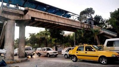 In Damascus on Sunday, there were shootings, raids by security forces, and a roadside bomb which exploded under this footbridge however, Damascans thought the day was quite peaceful.